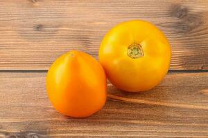 Ripe yellow bright juicy tomato photo