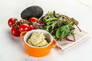 Creamy hummus in the bowl photo