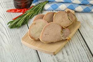 Baked pork tenderloin served rosemary photo