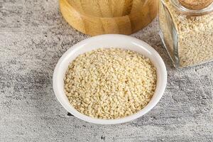 Sesame seeds heap in the bowl photo