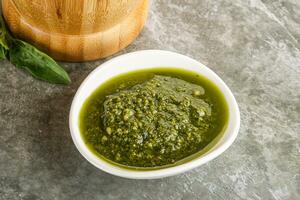 Homemade vegetarian basil pesto sauce photo