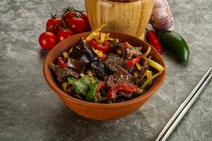 Asian wok with noodle, vegetables and beef photo