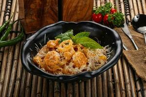 Italian pasta with shrimps and cheese photo