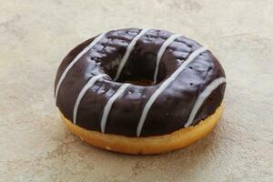 Glazed sweet tasty chocolate donut photo