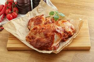 Marinated chicken leg in tomato sauce photo