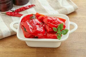 Marinated red bell pepper with oil photo