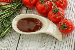 Tomato barbecue sauce on the bowl photo