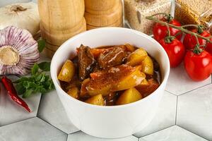 Homemade beef hungarian goulash with potato photo