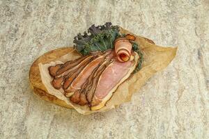 Italian traditional cuisine - prosciutto appetizer photo