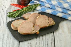 Baked pork tenderloin served rosemary photo