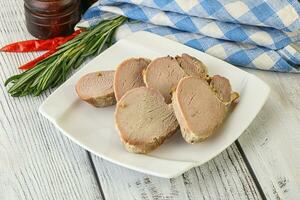 Baked pork tenderloin served rosemary photo