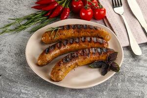 Grilled meat sausages with spices photo