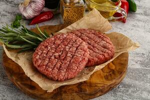 Raw burger cutlet for grill photo