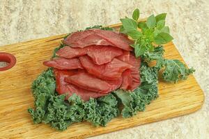 Sliced dried duck breast magret photo