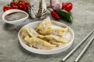 Japanese cuisine - dumplings gyoza with sauce photo