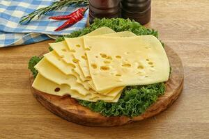 Sliced maasdam cheese for breakfast photo