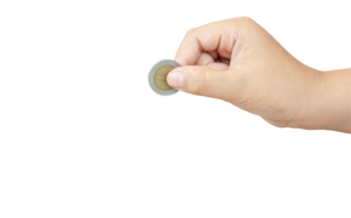 Child or kid hand holding coin isolated with clipping path in png file format. Concept of saving money for the future or money growth