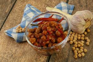 Baked chickpea with tomato sauce photo