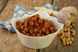 Baked chickpea with tomato sauce photo