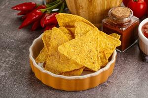 Mexican corn nachos chips with salsa photo