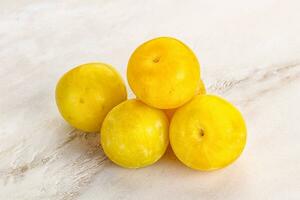 Yellow sweet plum heap fruit photo