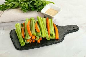 Vegan cuisine - dietary celery and carrot cticks photo