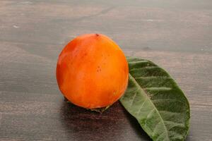 Fresh ripe sweet juicy persimmon photo