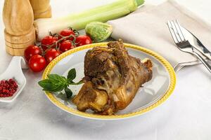 Baked Lamb shank with bone photo