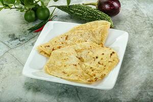 Indian tandori bread - naan with cheese photo