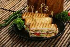 Club sandwich with chicken cheese and salad photo