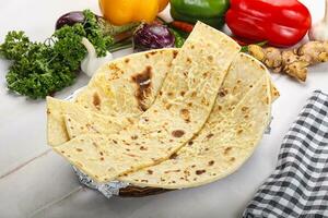 Indian bread cheese garlic naan photo