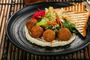 Israeli Falafel with hummus with bread photo