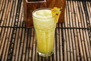 Sweet cold pineapple juice refreshment photo