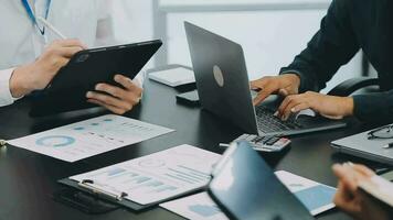 Business team meeting present, investor colleagues consultation and conference new strategy plan business and market growth on financial document graph report, Meeting and Talking. video