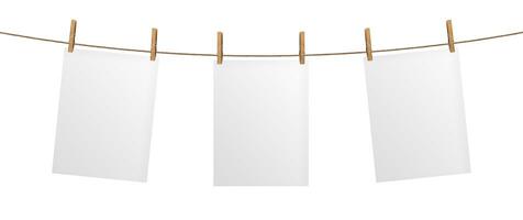 Empty paper sheet hanging on rope, isolated on white background photo