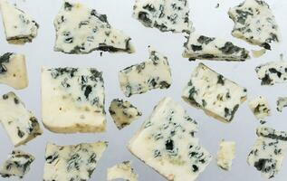 Danish blue cheese isolated on white background photo