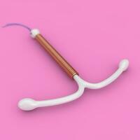 Birth Control Concept. T Shape IUD Copper Intrauterine Device. 3d Rendering photo