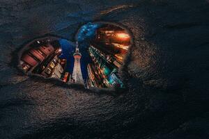 Love New York Concept. Reflection of Skyscrapers Buildings Street Through Puddle in Shape of Heart. 3d Rendering photo