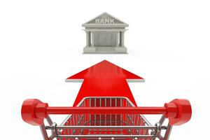 Buying Concept. Shopping Cart Trolley Over Go Forward Arrow Sign, Showing Direction to Bank Building. 3d Rendering photo