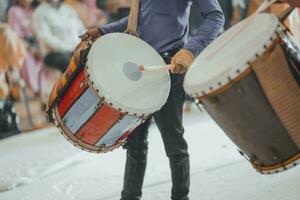 Man drumming in Indian wedding ceremonies, selective focus. photo