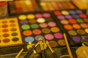 Eyeshadow Palette Decorative cosmetics. Makeup brushes. photo