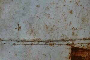 Scratched and rusted metal surface photo