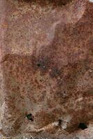 Scratched and rusted metal surface photo