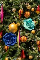 Close-up view of the Christmas ornaments hanging on the Christmas tree. photo