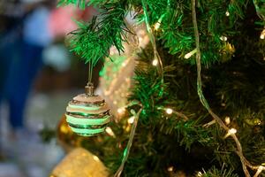 Close-up view of the Christmas ornaments hanging on the Christmas tree. photo