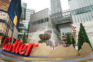 Beautiful Christmas decoration by Cartier in front of Pavilion Kuala Lumpur. People can seen exploring around it. photo