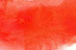 red watercolor on paper painted background texture photo