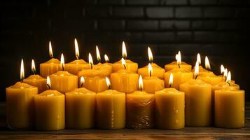 AI generated Many burning candles in the dark. yellow candles on a black background. Generate AI photo