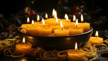 ai generado muchos ardiente velas en el oscuro. amarillo velas en un negro antecedentes. generar ai foto