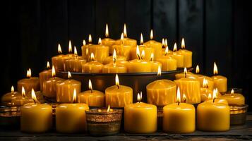 AI generated Many burning candles in the dark. yellow candles on a black background. Generate AI photo